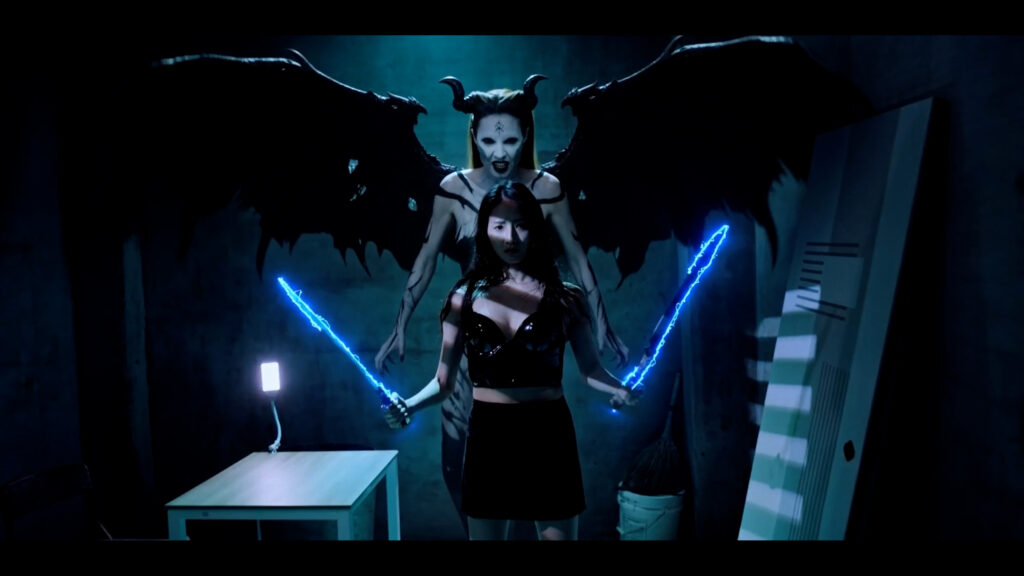 Sua with blue supernatural weapons and winged Nara in DEMON DANCER: SUA/NARA