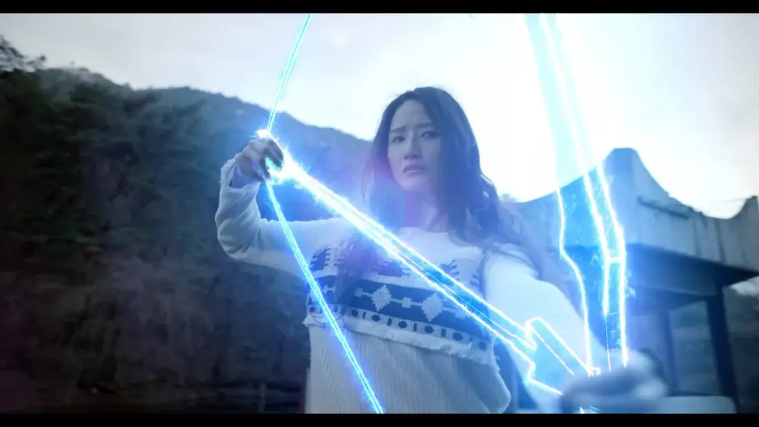 Sua surrounded by luminous blue supernatural weapons